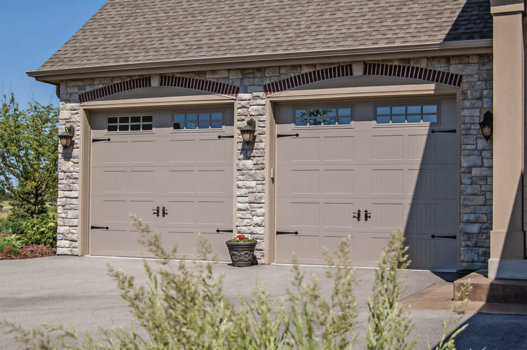 carriage garage doors on stone home